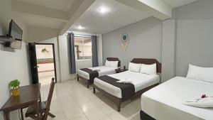 Hotel Balxibá alberca y estacionamiento