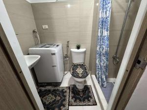 Entire 1 BR condo unit with balcony at MOA complex