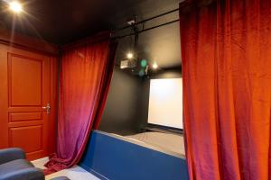 Appartements Le Grand Ecran - Studio Ambiance Cinema : photos des chambres