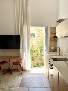 Appartements Home Chic Home - Les Suites de La Comedie : photos des chambres