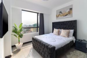 modern serenity suites apartments with swimming pool,modern equipped gym,private parking space, children playing ground, proximity to major shopping malls and unbeatable city views