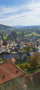 A room by a weir with a view of Rožmberk Castle