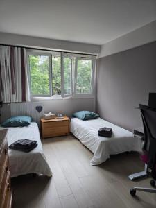 B&B / Chambres d'hotes Chambre d-hotes Paris La defense Arena : Chambre Double ou Lits Jumeaux - Vue sur Jardin