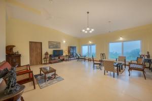 SaffronStays Silver Falls - 3BR colonial-style villa with pool, lawns, wooden bridge & monsoon waterfall views