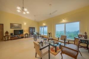 SaffronStays Silver Falls - 3BR colonial-style villa with pool, lawns, wooden bridge & monsoon waterfall views