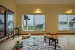 SaffronStays Silver Falls - 3BR colonial-style villa with pool, lawns, wooden bridge & monsoon waterfall views