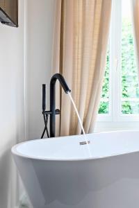 Appartements La Luxury - HyperCentre - Baignoire confort - Ambiance 5 etoiles : photos des chambres