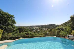 Maisons de vacances Villa de reve avec piscine et vue : photos des chambres