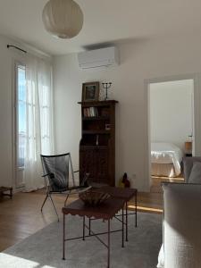 Appartements Le Central - Climatisation : photos des chambres