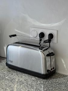 Appartements Le Central - Climatisation : photos des chambres