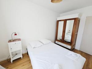 Appartements Appartement trois chambres avec jardin : photos des chambres