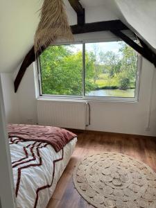 Maisons de vacances Maison cosy avec jardin, riviere et ponton prive : photos des chambres