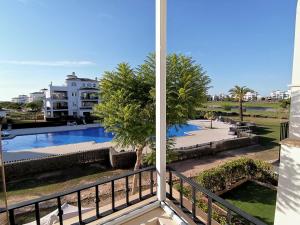 Hacienda Riquelme Golf Retreat with pool view and sunny terrace