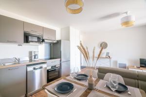 Appartements Ambiance Mer - Avec terrasse : photos des chambres