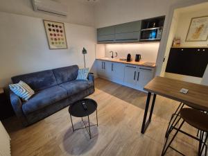 Appartements Logement L-Olivier TREVOUX climatise : photos des chambres