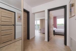 Pastel Apartment with Balcony and Parking by Noclegi Renters