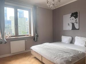 A cozy and bright room in the heart of Warsaw with a view of the Palace of Culture