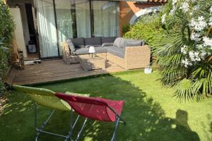 Apartment with garden at the foot of the harbor