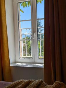 B&B / Chambres d'hotes La Maison d-Arlette - Maison d-Hote et Gite au coeur de l-Isere a 10 mn de Voiron, capitale de la Chartreuse, et du Lac de Paladru : photos des chambres