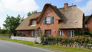 Ferien unterm Reetdach Whg 01