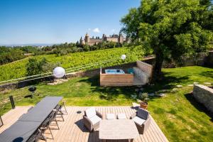 Maisons de vacances L'ecrin de la Cite, Coeur de Vignes - Vivez une experience inoubliable ! : photos des chambres