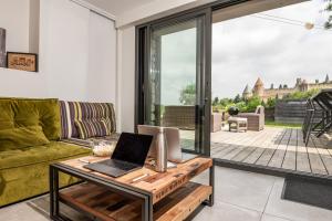 Maisons de vacances L'ecrin de la Cite, Coeur de Vignes - Vivez une experience inoubliable ! : photos des chambres