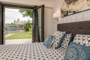 Maisons de vacances L'ecrin de la Cite, Coeur de Vignes - Vivez une experience inoubliable ! : photos des chambres