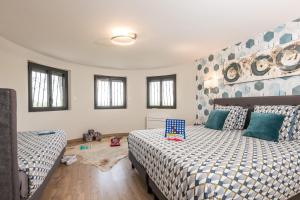 Maisons de vacances L'ecrin de la Cite, Coeur de Vignes - Vivez une experience inoubliable ! : photos des chambres