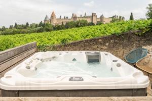 Maisons de vacances L'ecrin de la Cite, Coeur de Vignes - Vivez une experience inoubliable ! : photos des chambres