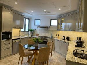 Palm Jumeirah Beachfront private pool villa 5 BR & 1 maids room with access to beach