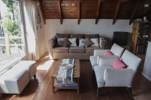 Cabaña costa de lago en complejo de cabañas