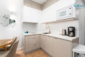 SWAN Kołobrzeg Apartament KASPROWICZA 20C BASEN, SIŁOWNIA, BAWIALNIA - wszystko w cenie