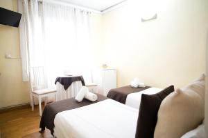 Twin Room with Private External Bathroom room in Petit Hotel