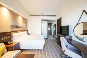 Connecting Queen Family Room with Sofa Bed room in Hampton By Hilton Dubai Airport