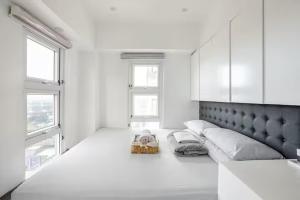 Balai ni Boss - Cozy Modern 1BR in Victoria Sports Tower