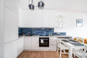 Tuwima Harmony City Life Apartment by BookingHost