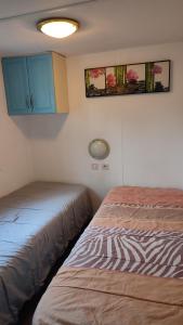 Mobil-home climatisé dans parc résidentiel avec piscine