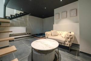 Appartements La Suite - Jacuzzi - Hammam : photos des chambres