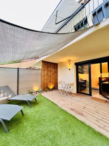 Appartements Garden & Grace- home cinema, petit dejeuner et parking : photos des chambres