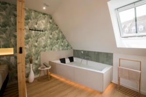 Appartements L-Exotique Baignoire Double Cozy Duplex : photos des chambres