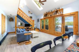 Waterfront with Kayaks SUPs and Ping Pong Table