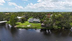 Riverside Oasis Home w Tiki Hut & Firepit