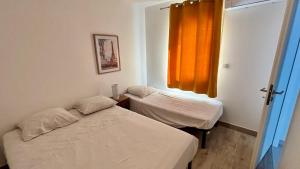Maisons de vacances Lits faits, valise a poser, 3 mn Futuroscope : photos des chambres