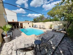 Maisons de vacances Maison calme avec piscine : photos des chambres