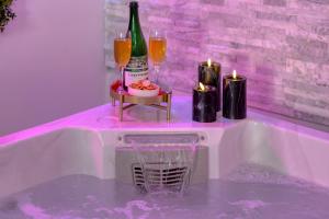 Appartements Dalikyda La Tentation Jacuzzi Cinema elegant : photos des chambres