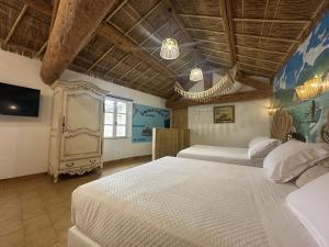 Appartements Studio Tahiti du Cloitre : photos des chambres