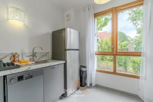 Maisons d'hotes La Villa Maupiti, 12pers, 7 min Disneyland Paris : photos des chambres