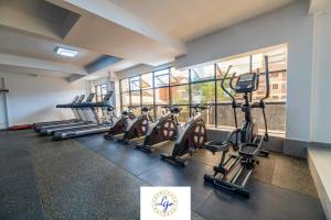 furnished two bedroom apartment with swimming pool, fully equipped gym, private parking space ,children playground and unbeatable scenic city views in kilimani