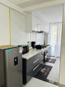 furnished two bedroom apartment with swimming pool, fully equipped gym, private parking space ,children playground and unbeatable scenic city views in kilimani