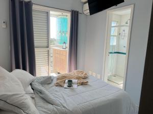 Home 1 | Ap Cinema Frente Mar com Piscina Aquecida em Bertioga